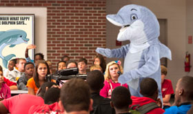 Fappy® The Anti-Masturbation Dolphin seen here speaking to children about the dangers of masturbation.